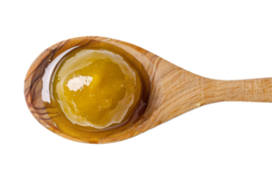 AI generated Green Olives in Oil on Wooden Spoon png