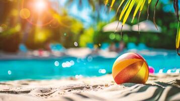 AI generated Colorful beach ball on the sand near the swimming pool. Summer vacation concept photo