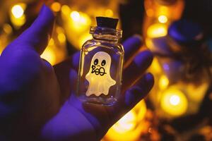 AI generated Halloween concept. Hand holding a bottle with a ghost in it photo