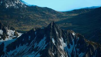 A very tall mountain with some snow on it video