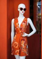 AI generated Fashionable evening orange summer dress on a mannequin. ai generative. ai generative photo