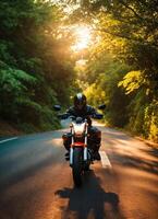 ai generado motociclista montando un motocicleta en un país la carretera a puesta de sol. ai generativo foto