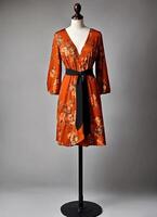 AI generated Fashionable evening orange summer dress on a mannequin. ai generative. ai generative photo