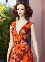AI generated Fashionable evening orange summer dress on a mannequin. ai generative. ai generative photo