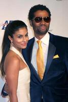 Manuela Testonini  Eric Benet arriving at Music Cares Man of the Year Dinner honoring Neil Diamond at the Los Angeles Convention Center in Los Angeles CA on February 6 2009 photo