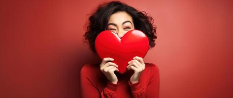 Portrait of a happy woman with red heart on a red background.Valentine's Day Concept AI generated photo