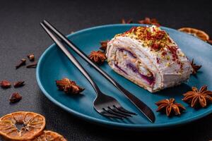 A piece of delicious sweet meringue roll with mascarpone cheese, berries and almonds photo
