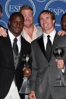 LOS ANGELES, JUL 14 - Reggie Bush, Jeremy Shockey and Drew Brees pose along with members of the New Orleans Saints after winning the ESPY for Best Team in the Press Room of the 2010 ESPY Awards at Nokia Theater, LA Live on July14, 2010 in Los Angeles, CA photo