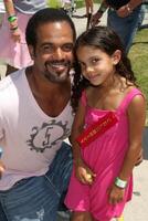 Kristoff St. John  Daughter Lola  at the Celebrity Miniature Golf Tourament at Boomer's in Irvine, CA,  on  July 26, 2009 photo
