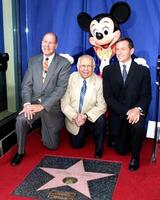 Michael Eisner, Johnny Grant, Mickey Mouse, Robert Iger Disney Store Hollywood Blvd Disney 50th Anniv Special Recongition from Hollywood Trust Los Angeles, CA July 14, 2005 photo