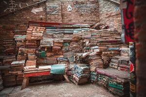 Cozy and Inviting Interior of Old Brick Building with Pile of Literature and Fiction Books photo