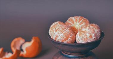 Tangerines in a plate on the table. 4k video