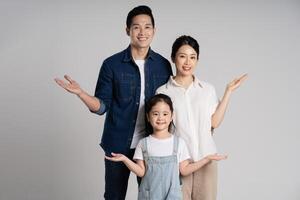 Asian family portrait posing on white background photo