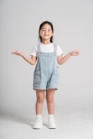 Portrait of a lovely Asian baby girl posing on a white background photo