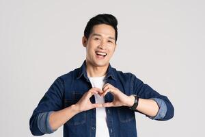 Portrait of Asian man posing on white background photo