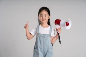 Portrait of a lovely Asian baby girl posing on a white background photo