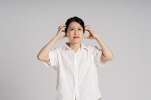 Portrait of beautiful asian woman posing on white background photo