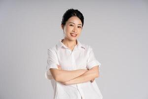 Portrait of beautiful asian woman posing on white background photo