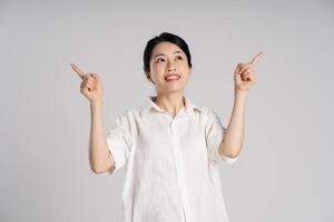 Portrait of beautiful asian woman posing on white background photo