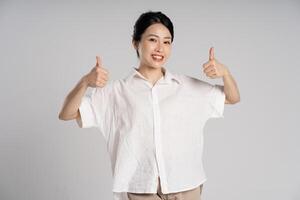 Portrait of beautiful asian woman posing on white background photo