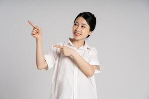 Portrait of beautiful asian woman posing on white background photo