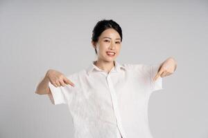 Portrait of beautiful asian woman posing on white background photo