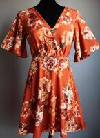 AI generated Fashionable evening orange summer dress on a mannequin. ai generative. ai generative photo