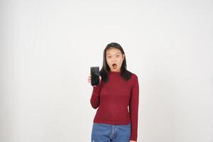 Young Asian woman in Red t-shirt Wow Shocked and Showing smartphone blank screen isolated on white background photo