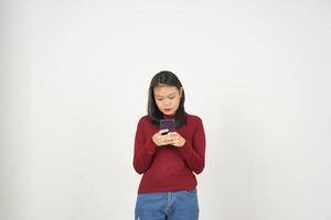 Young Asian woman in Red t-shirt Smile while using smartphone, Texting concept isolated on white background photo