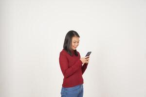 Young Asian woman in Red t-shirt Smile while using smartphone, Texting concept isolated on white background photo