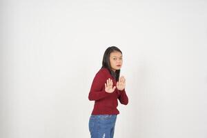 Young Asian woman in Red t-shirt Stop hand gesture, Rejection concept isolated on white background photo