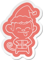 funny quirky cartoon  sticker of a monkey with christmas present wearing santa hat png