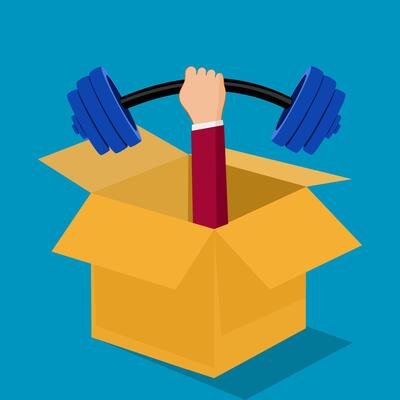 Businessman holding weights and boxes