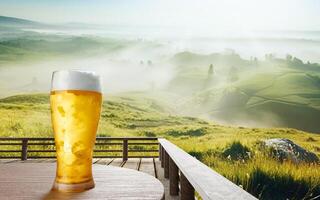 Draft or craft beer in clear glass with beer foam on top Put on set of wooden tables. Lounge seating on the wooden terrace with mountain background with god light or sunlight.3d rendering photo