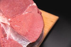Raw large premium steak. Raw fresh premium beef in shallow depth of field photo