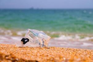 Shallow depth of field snorkeling mask lies on a sandy beach overlooking the sea and sky, no people photo