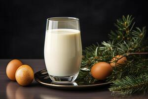 AI generated Close-up of a sweet milk-based drink in glass, eggs and Christmas tree branch on a table indoors photo