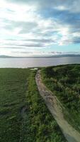 Vertical Drone Footage of limboto lake, Gorontalo- Indonesia. New Road Along Lake's Edge Takes Shape video