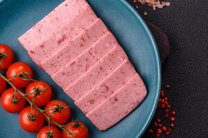 Delicious canned pink ham with salt, spices and herbs photo