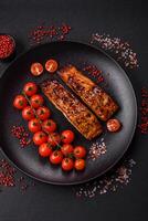 Delicious red salmon fish grilled with sauce and sesame, spices and herbs photo