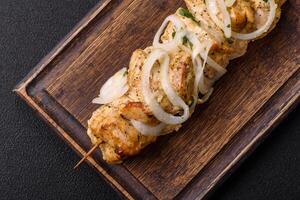 Delicious fresh chicken meat kebab with salt, spices and herbs photo