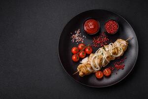 Delicious fresh chicken meat kebab with salt, spices and herbs photo