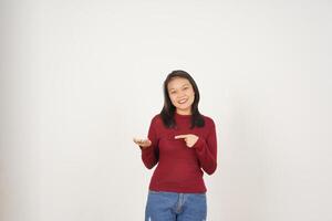 Young Asian woman in Red t-shirt Showing and holding on open palm copy space isolated on white background photo