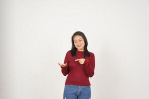Young Asian woman in Red t-shirt Showing and holding on open palm copy space isolated on white background photo
