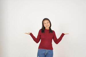 Young Asian woman in Red t-shirt Showing and holding on open palm copy space isolated on white background photo