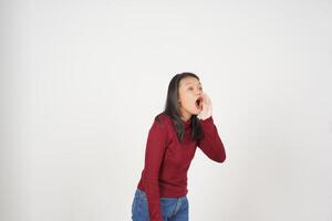 Young Asian woman in Red t-shirt announcement shout advertising isolated on white background photo