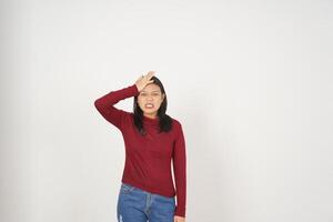 Young Asian woman in Red t-shirt hand on head, Forget something gesture isolated on white background photo