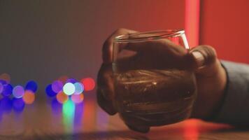 Close up of two people are cheering with cocktails in a bar or disco club. video