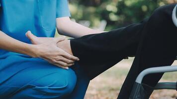 young asian physical therapist working with senior woman on walking with a walker video