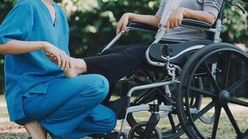 young asian physical therapist working with senior woman on walking with a walker video